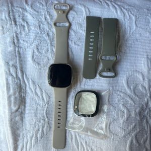 Gold Fitbit Versa 3 with original band